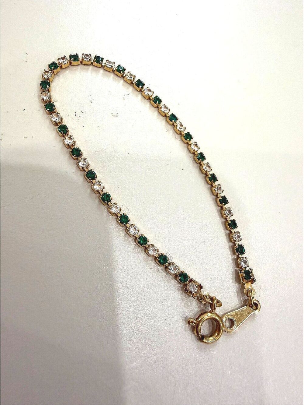 Avon Gold Tone Tennis Bracelet with Green and Clear Stones 6"